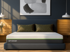 Modern bedroom with a stylish mattress on a dark grey bed frame and minimalist decor